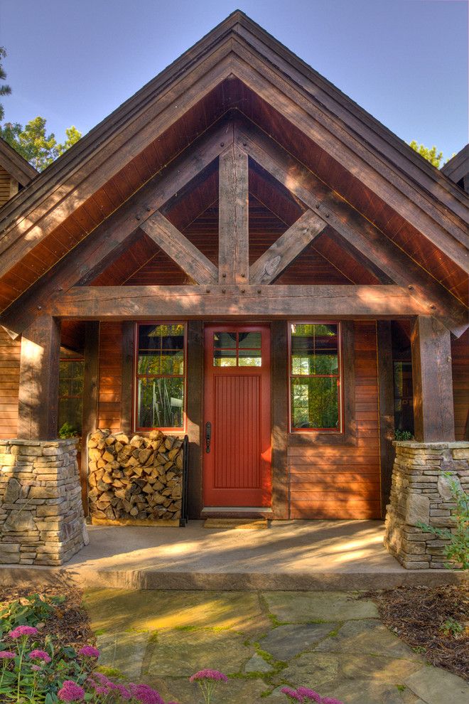 Timber Wolf Size for a Rustic Porch with a Stone and Thunder Lake Entry by Lands End Development   Designers & Builders