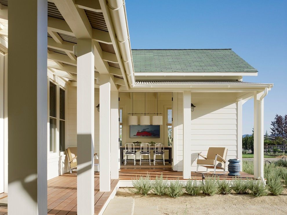 Tin Roof Rusted for a Farmhouse Porch with a Verandah and St. Helena Residence by Jennifer Robin Interiors