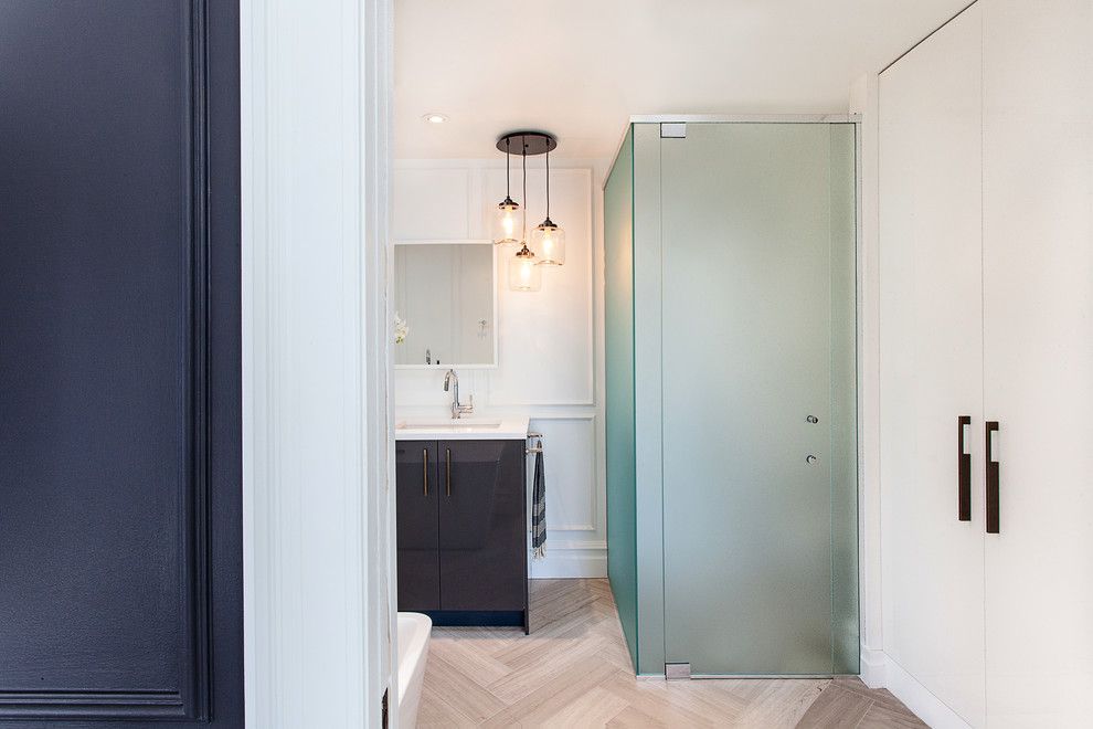 Tint Masters for a Contemporary Bathroom with a Herringbone Pattern and Clarendon Avenue by Veronica Martin Design Studio