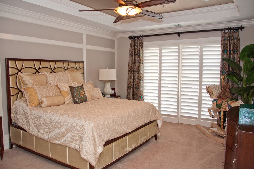 Tint Masters for a Transitional Bedroom with a Raised Ceiling and Custom Window Treatments in Miromar Lakes Home by Beverly Hills Window Tinting and Treatments