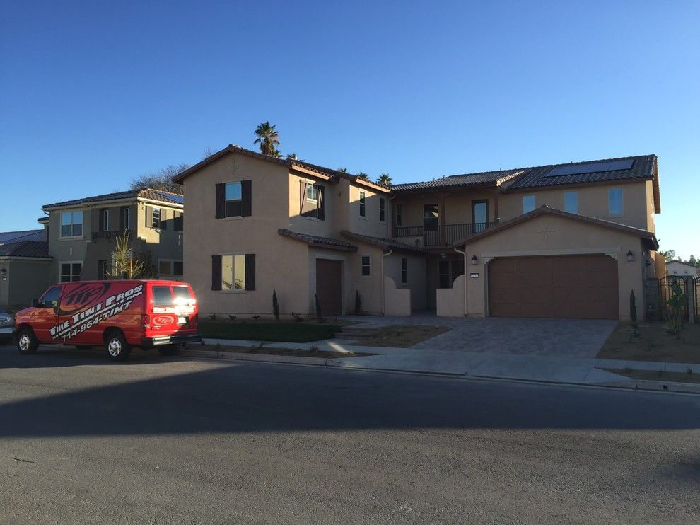 Tint Pros for a Traditional Exterior with a Tinting and Our Work by the Tint Pros