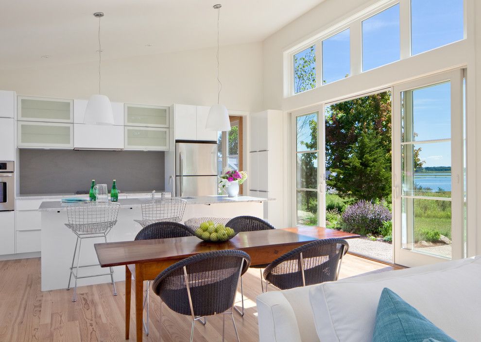 Tmart Furniture for a Beach Style Dining Room with a White Kitchen and Long Lane by Jacob Talbot   Fine Homebuilders