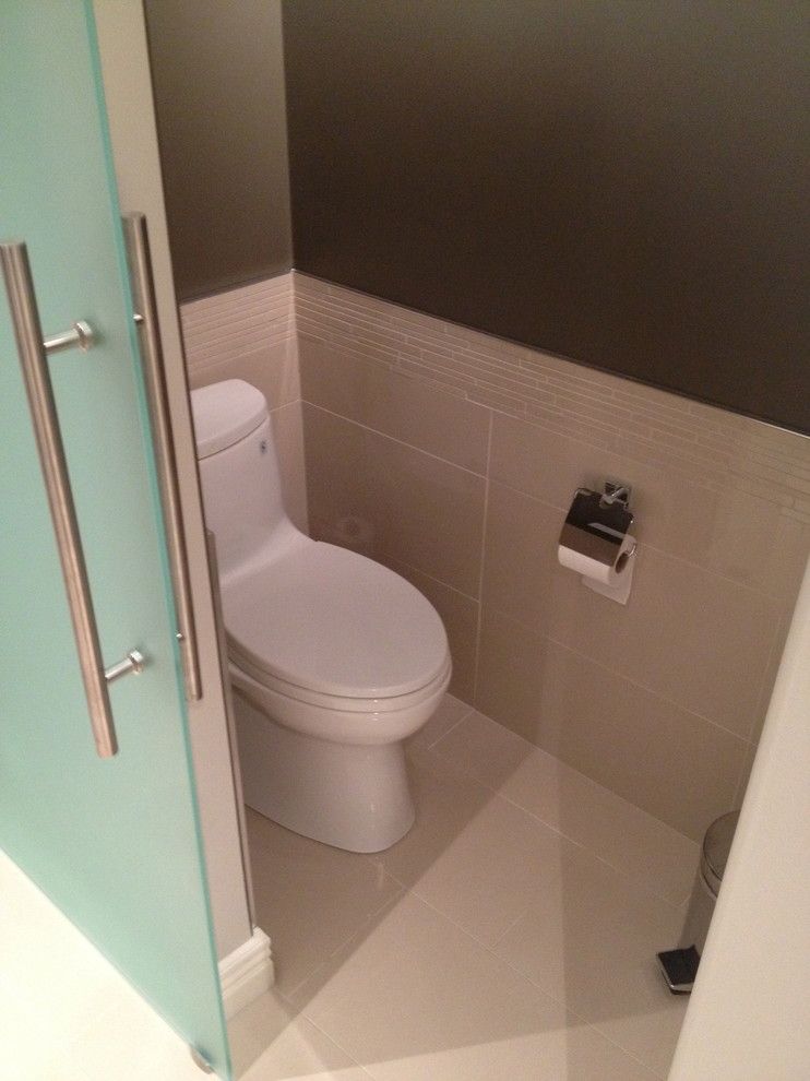 Toliet for a Contemporary Spaces with a Sliding Glass Door and Bathroom Renovations by Tay Ky Developments