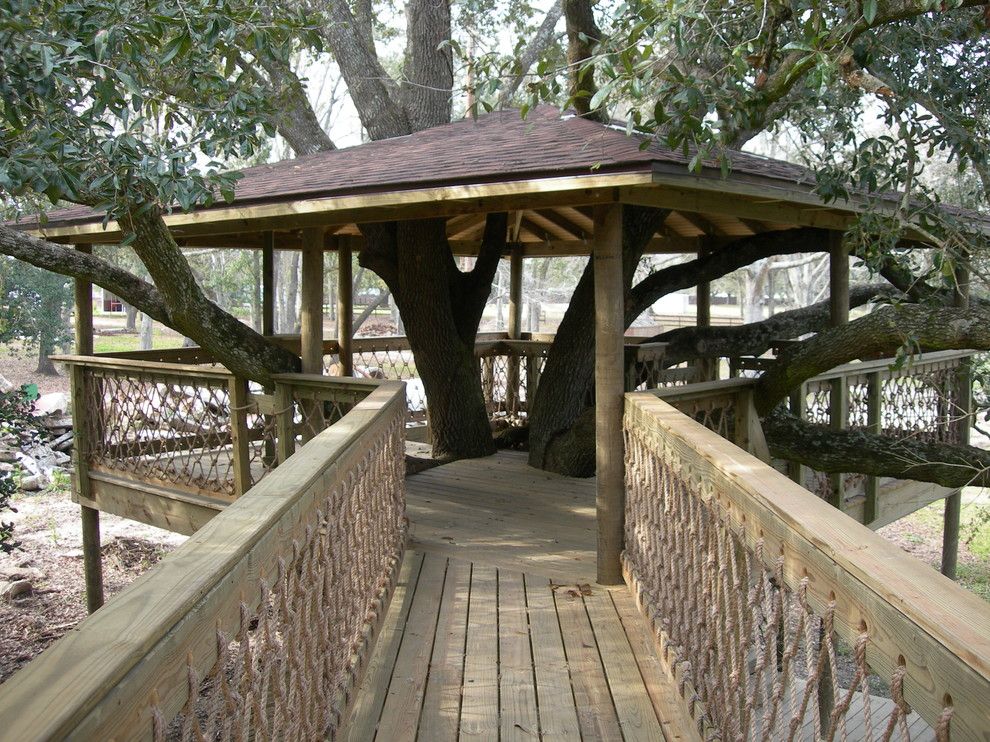 Treehouse Builders for a Traditional Patio with a Custom Tree House and Tree Houses and Play Sets by Backyard Builders