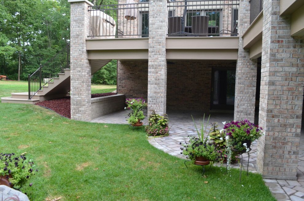 Trex Select for a Traditional Porch with a Composite Wood Decking and Azek Composite Wood Deck with Brick Columns in Homer Glen, Illinois by Millennium Construction