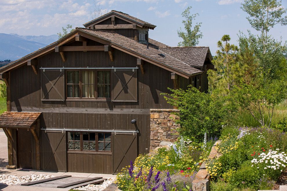 Trimountain for a Rustic Exterior with a Truss and Rocky Mountain Homes  Mountain Timberframe by Rocky Mountain Homes