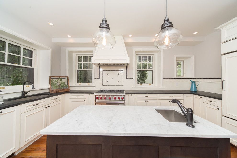 Tudor Oaks for a Traditional Kitchen with a Heart Pine Flooring and Complete Restoration of a 110 Year Old Tudor Style Home by Red Oak Builders, Llc