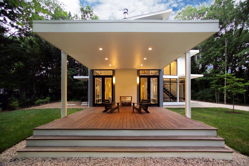 Turf Masters for a Contemporary Porch with a Cantilever and Riverside Residence by Moore Architects, Pc