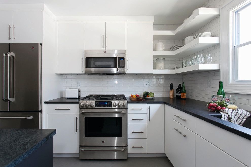 Ultratec for a Contemporary Kitchen with a Granite Countertops and Contemporary and Clean Kitchen in White by Ultracraft Cabinetry