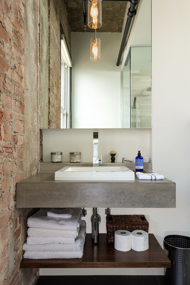 Unclogging a Sink for a Industrial Bathroom with a Exposed Brick and Hermann Loft Renovation by Content Architecture