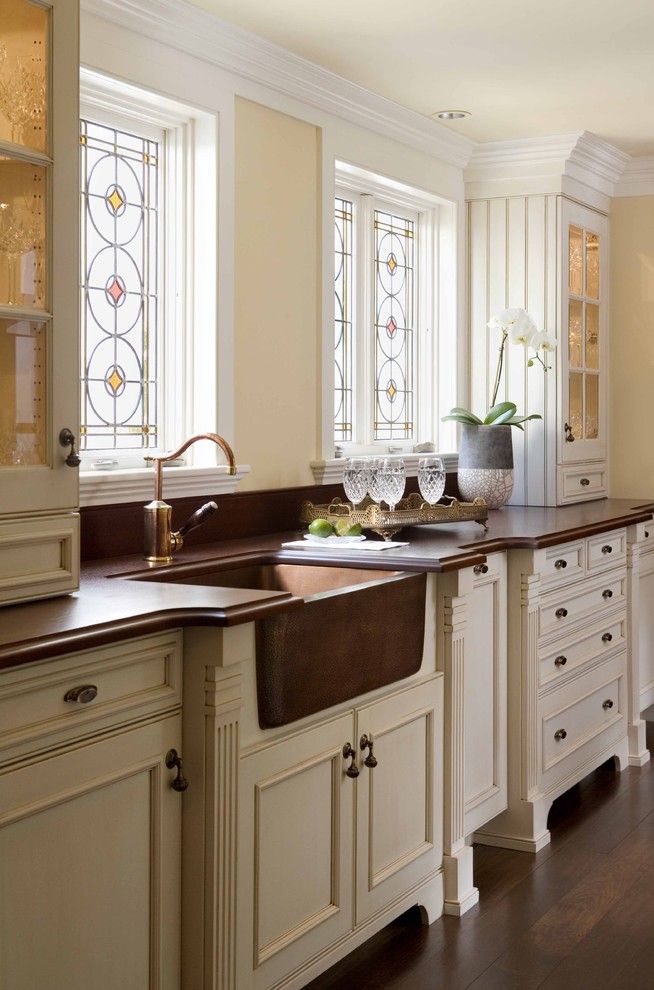 Unclogging a Sink for a Traditional Kitchen with a Oil Rubbed Bronze and Chestnut Street Kitchen by Venegas and Company