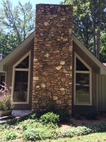 Vanguard Charlotte Nc for a Transitional Spaces with a Vertical Board Batten Siding Replacement and Exterior Home Transformation in Statesville, Nc, by Belk Builders by Belk Builders