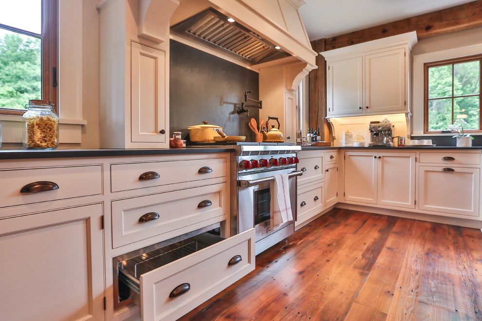 Vantage Lighting for a Farmhouse Kitchen with a Slate and Meadowbrook Barn by Teakwood Builders, Inc.