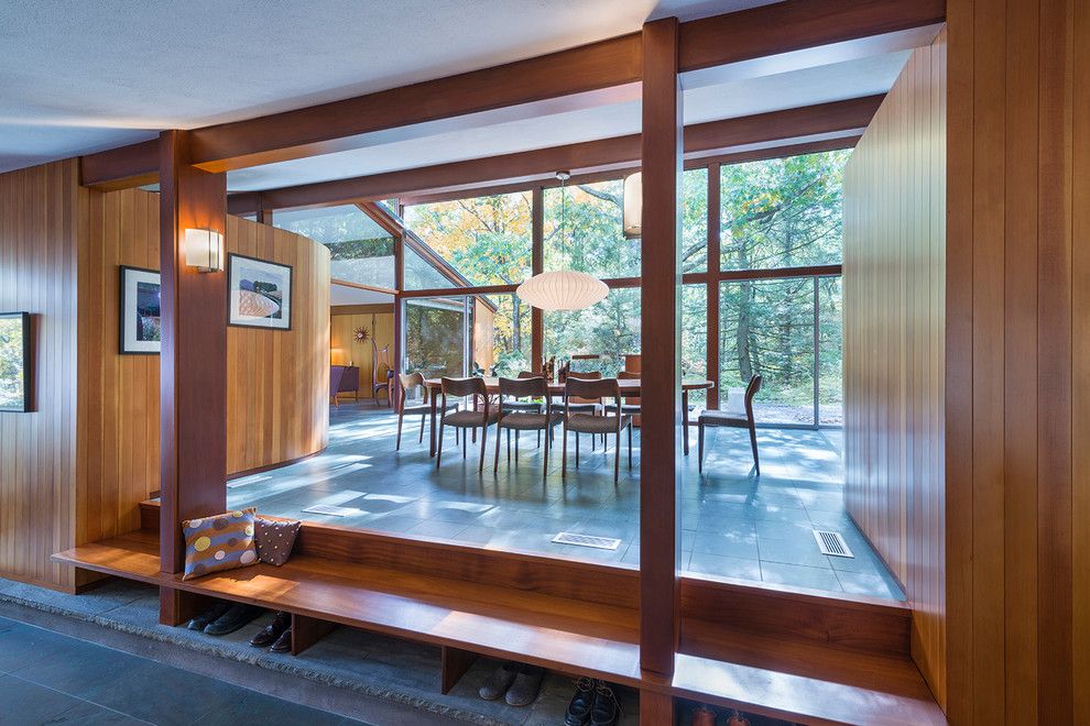 Walter Gropius for a Midcentury Dining Room with a Gable Room and Sculpted to the Land by Flavin Architects