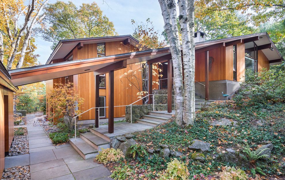 Walter Gropius for a Midcentury Exterior with a Verticle Douglas Fir Siding and Sculpted to the Land by Flavin Architects