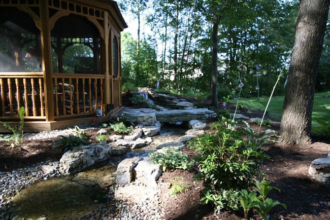 Water Gardens Spanish Fork for a Traditional Landscape with a Natural Stone Waterfall and Waterscape Projects by Perennial Landscaping