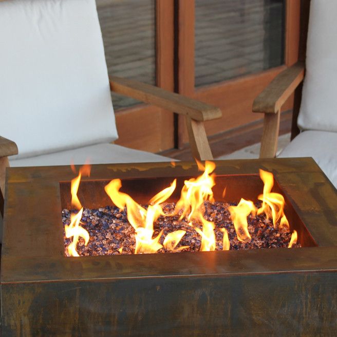 Weathering Steel for a Modern Patio with a Fire Pit Table and Fire Pits   Great for Fall and Winter by Authenteak Outdoor Living