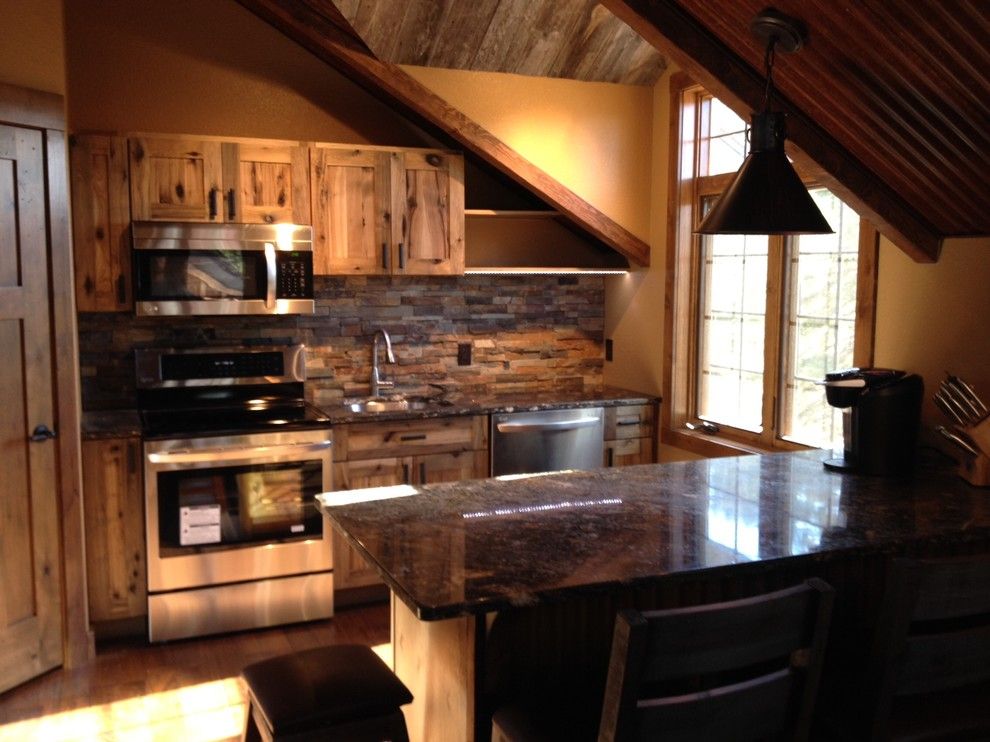 Weathering Steel for a Rustic Kitchen with a Weathered Steel and Carriage House by Debbie Waldner