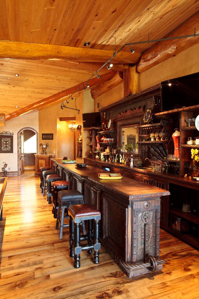 Westec for a Rustic Home Bar with a Arched Doorway and Awesome Log Cabin by Passion Lighting