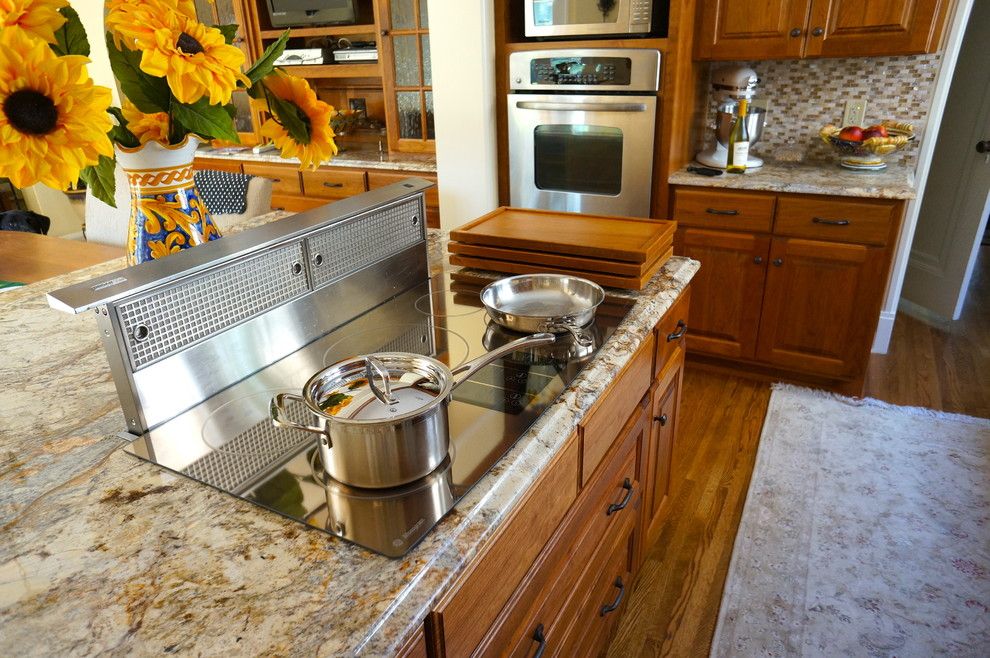 What is an Induction Cooktop for a Traditional Kitchen with a Serving and Custom Cherry Cooktop Cover by Home Restoration Services, Inc.