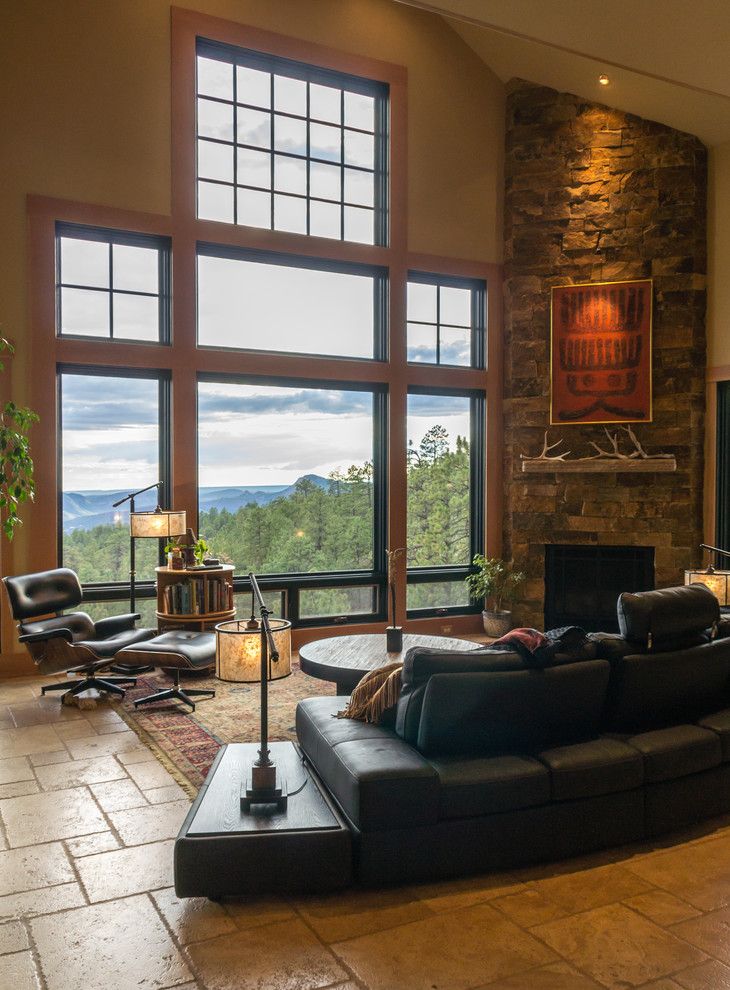 Wholesale Builders Supply for a Rustic Living Room with a Curved Sectional and Mountain Zen by Kogan Builders