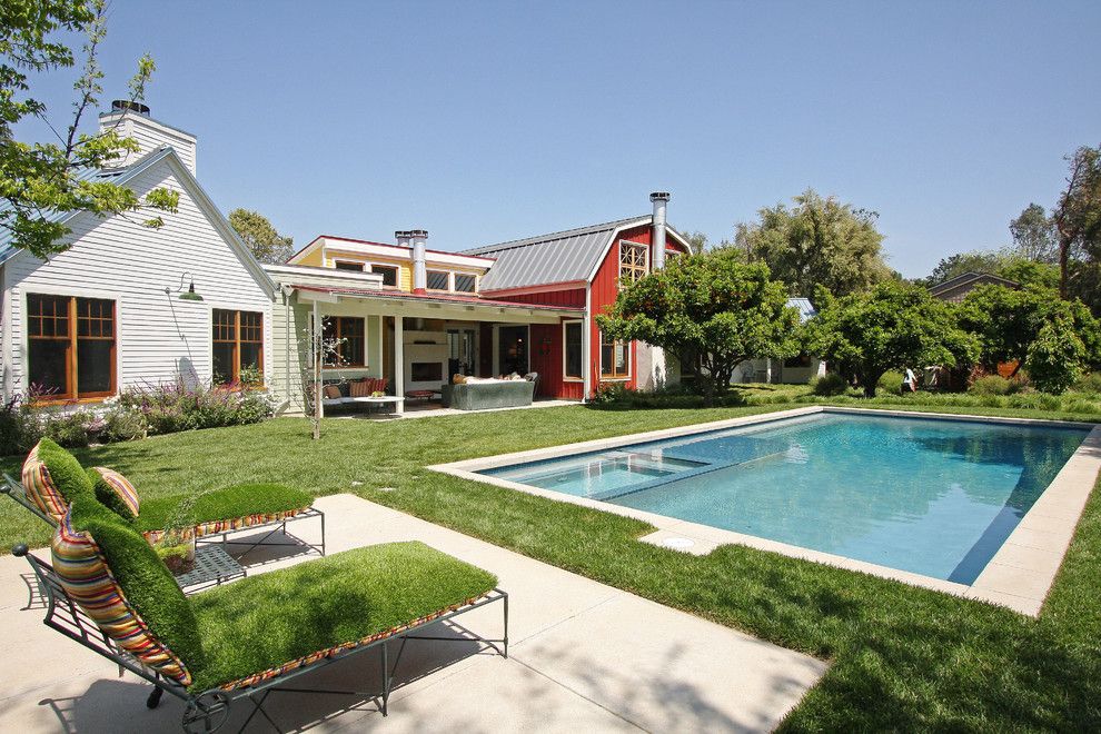 Woerner Turf for a Farmhouse Pool with a Red House and Contemporary Barn by Gus Duffy Aia