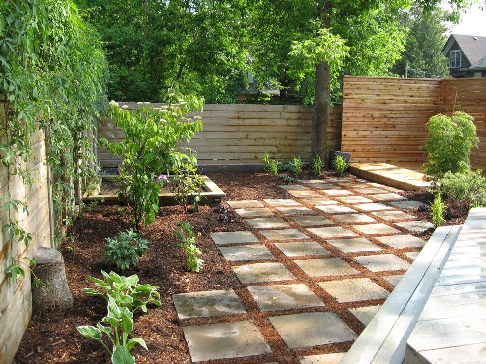 Woerner Turf for a Modern Landscape with a Japanese Maple and Outdoor Dining Terrace by Genus Loci Ecological Landscapes Inc.