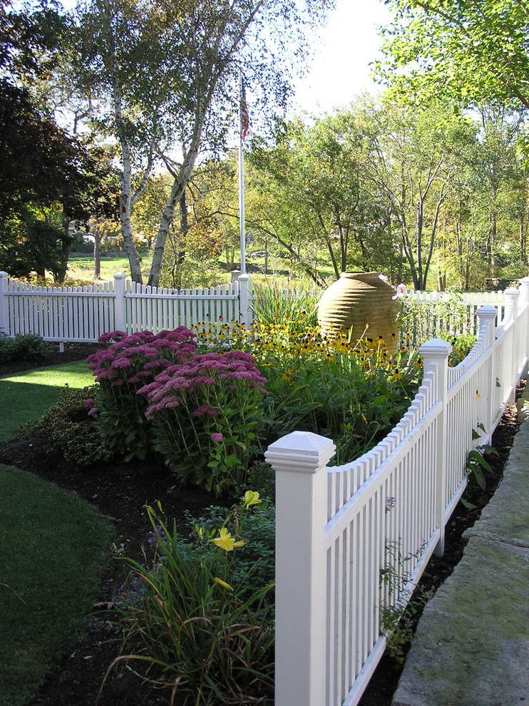 Woerner Turf for a Traditional Landscape with a Grass and Family Pool by Woodburn & Company Landscape Architecture, Llc