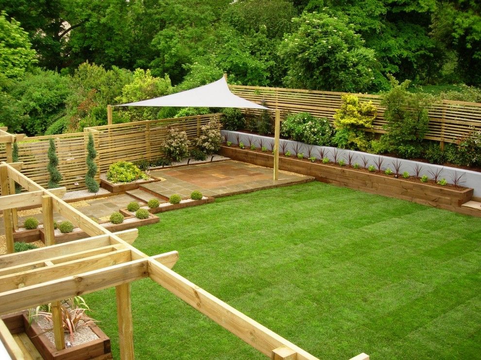 Woerner Turf for a Traditional Landscape with a Shade Structure and Eggs Garden by Ben Kirbyshire