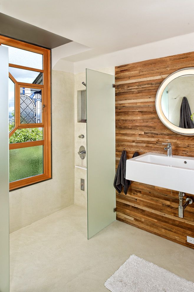 Wood Lathe Projects for a Contemporary Bathroom with a Circular Mirror and Prentiss Bathroom by Prentiss Balance Wickline Architects