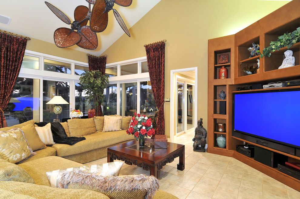 Zanos for a Tropical Home Theater with a Collection and Grand Media Room by Bella Luna Services, Inc.